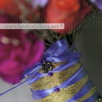 Свадебный букет из розовых орхидей цимбидиум с сиреневой и фиолетовой гвоздикой и оранжевыми розами